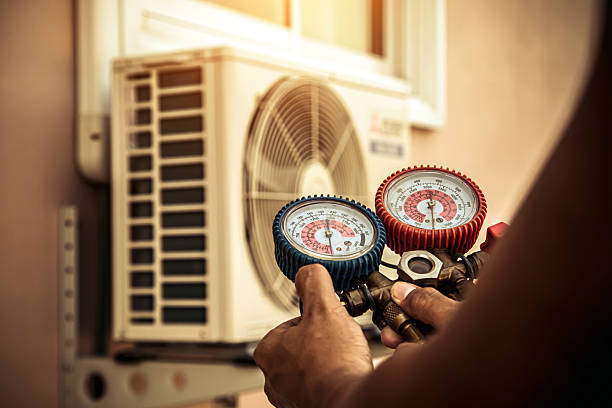 Professional Air Conditioning Service technician working in Creve Coeur, IL